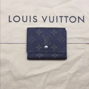 Louis Vuitton monogrammed wallet trio